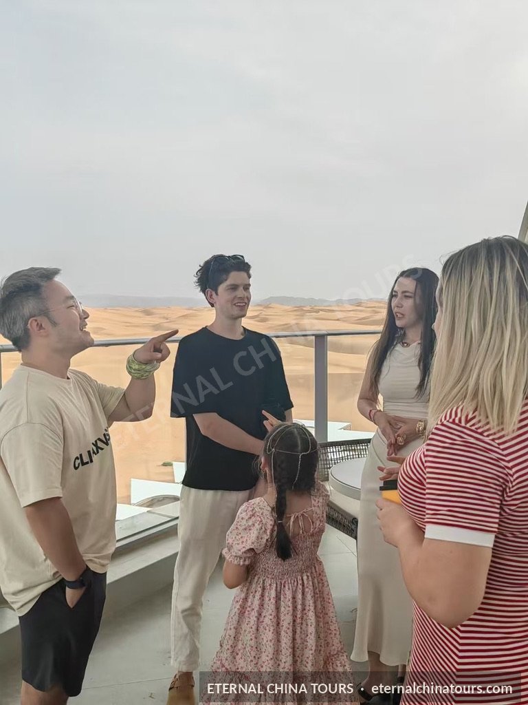 A family group chatting at a scenic viewpoint