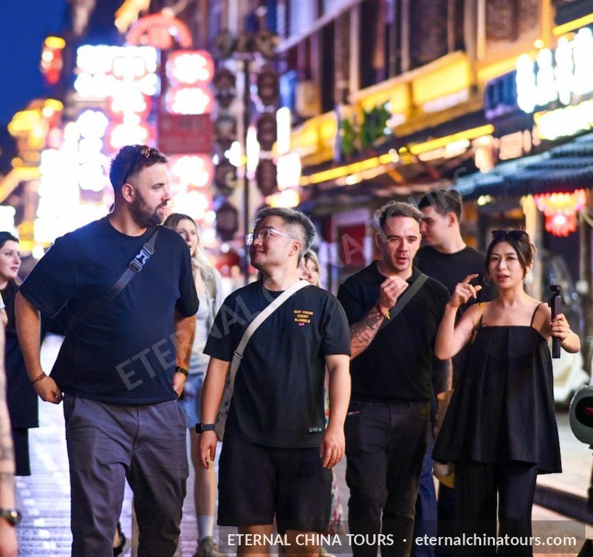 An evening walk through a neon-lit street